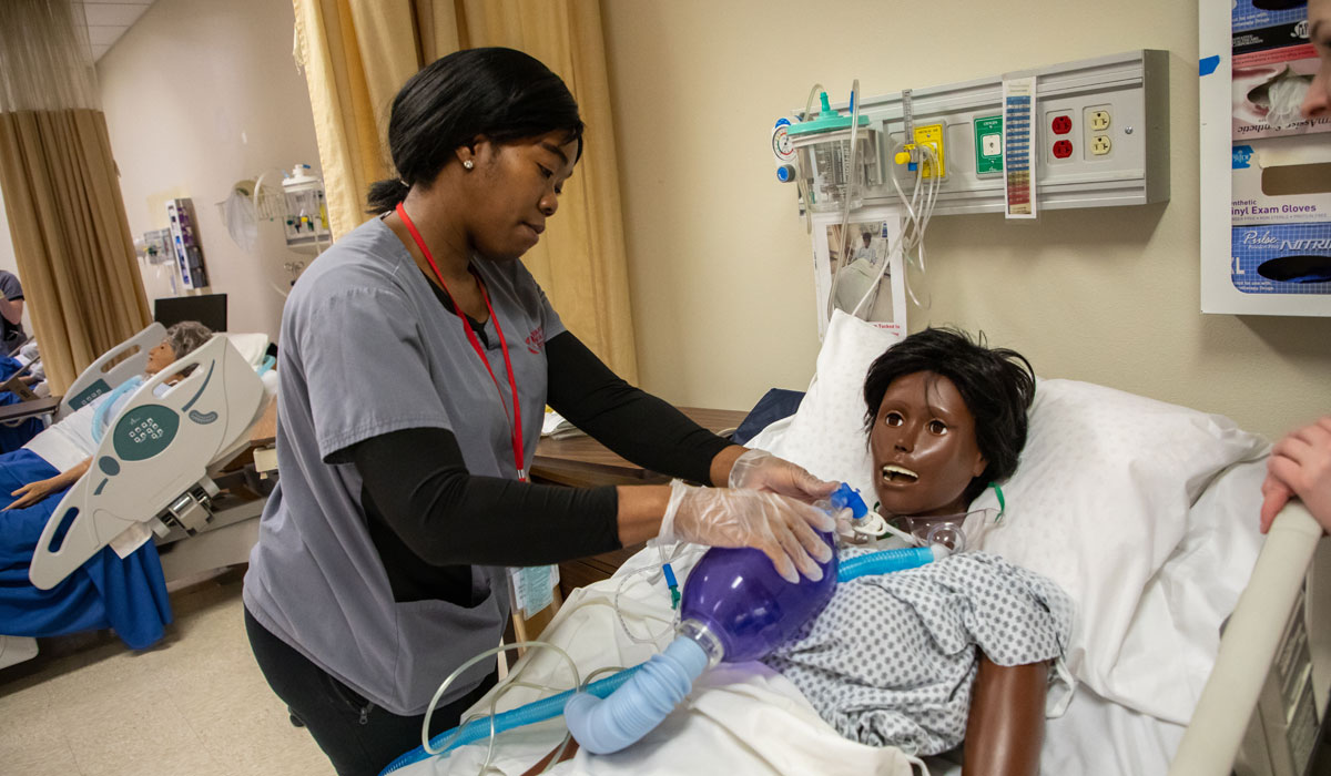 yvc nursing student works on a test patient during class. 