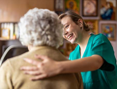 Community Health worker tends to a senior citizen.