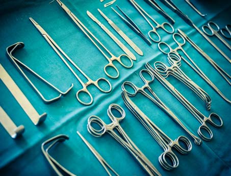 Surgical tools lay out on a table during surgery.