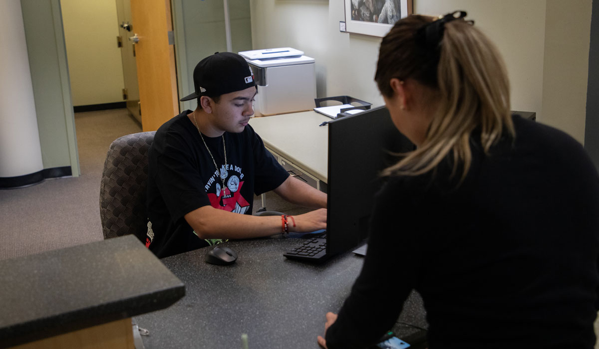 Student receives assistance at a YVC admin office. 