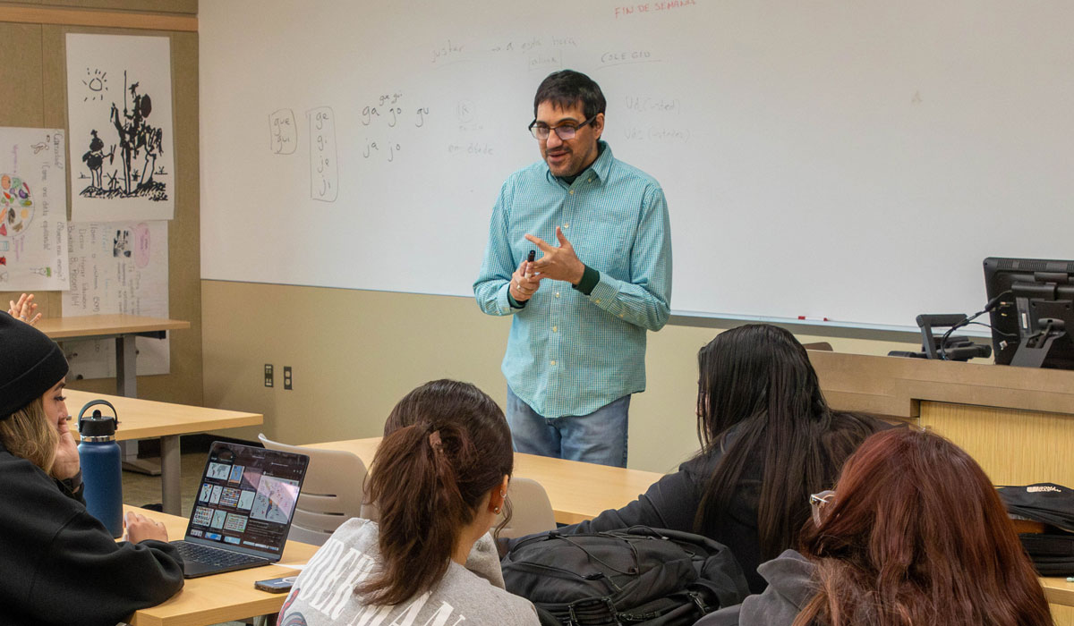 Instructor speaks to his class. 