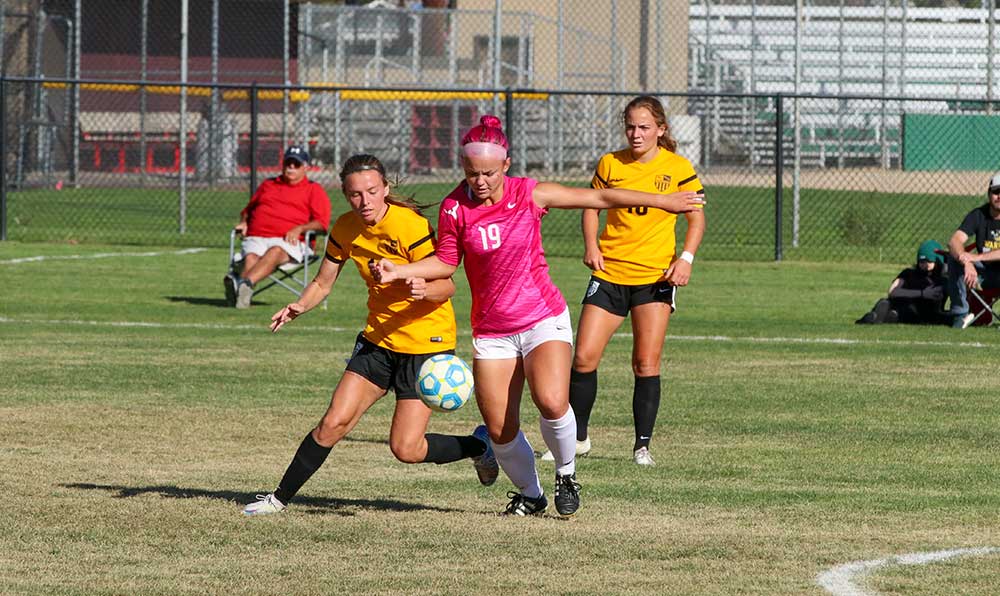 Female soccer player with ball