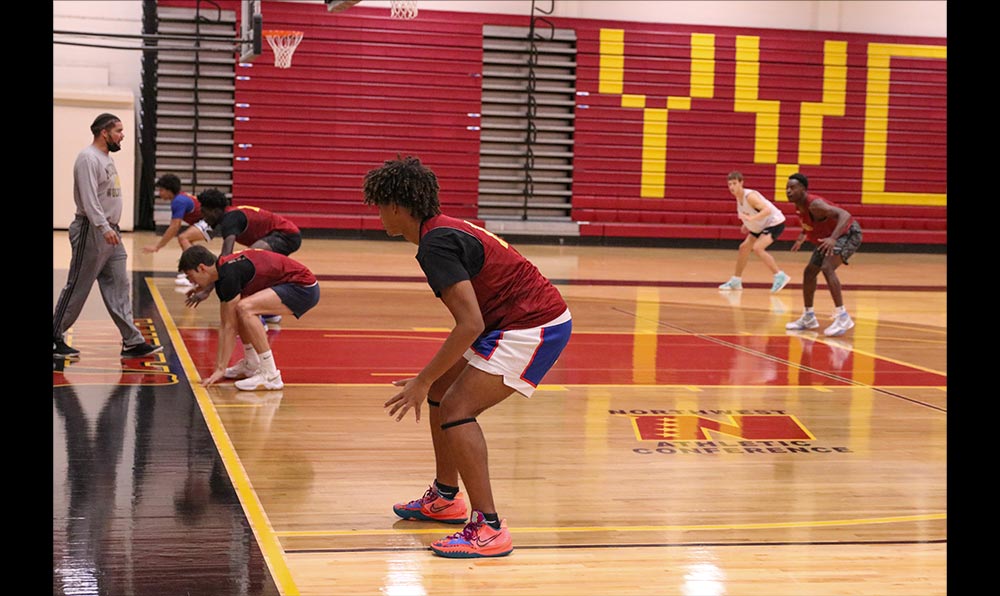 Male basketball players practicing