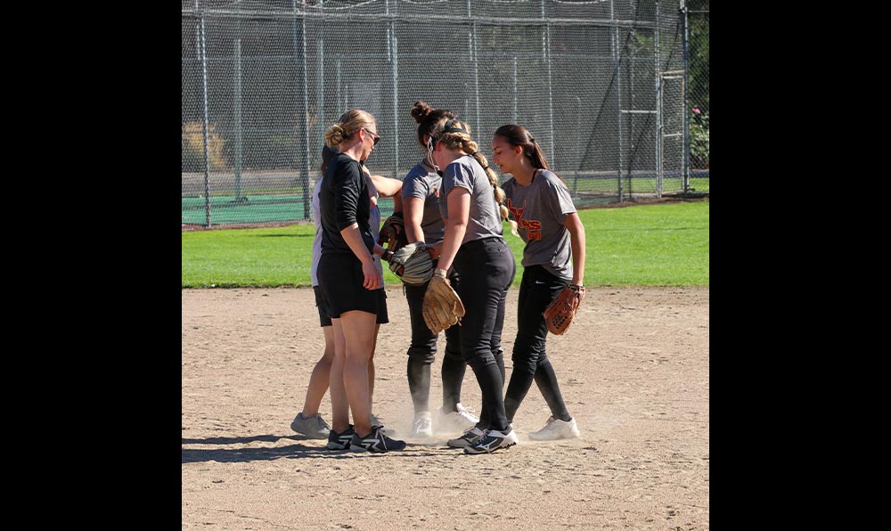 Huddle of softball players