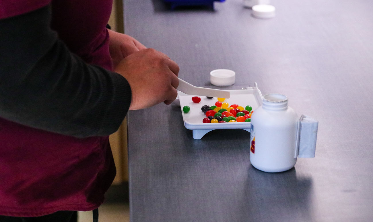 Pharmacist counting pills