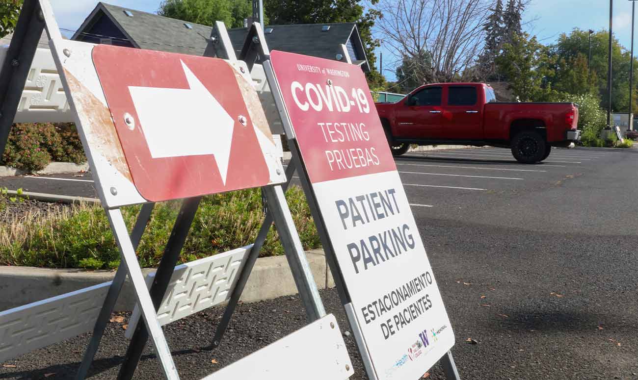 COVID testing sign in parking lot