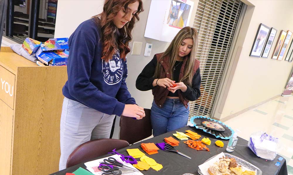 Students make paper flowers