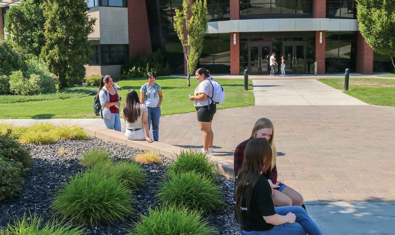 Students on campus in front of Glenn Anthon Hall