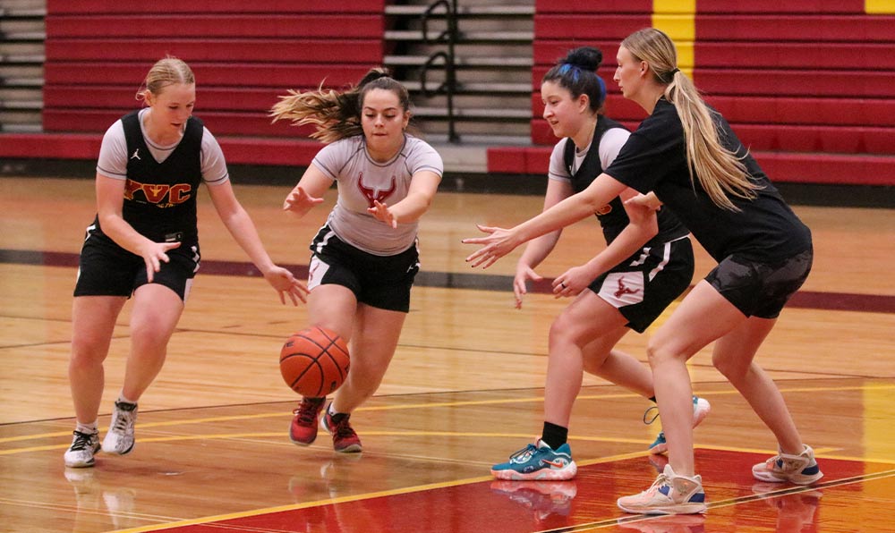 Women's basketball players practicing