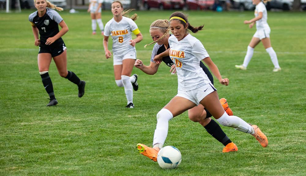 Women's soccer player with ball