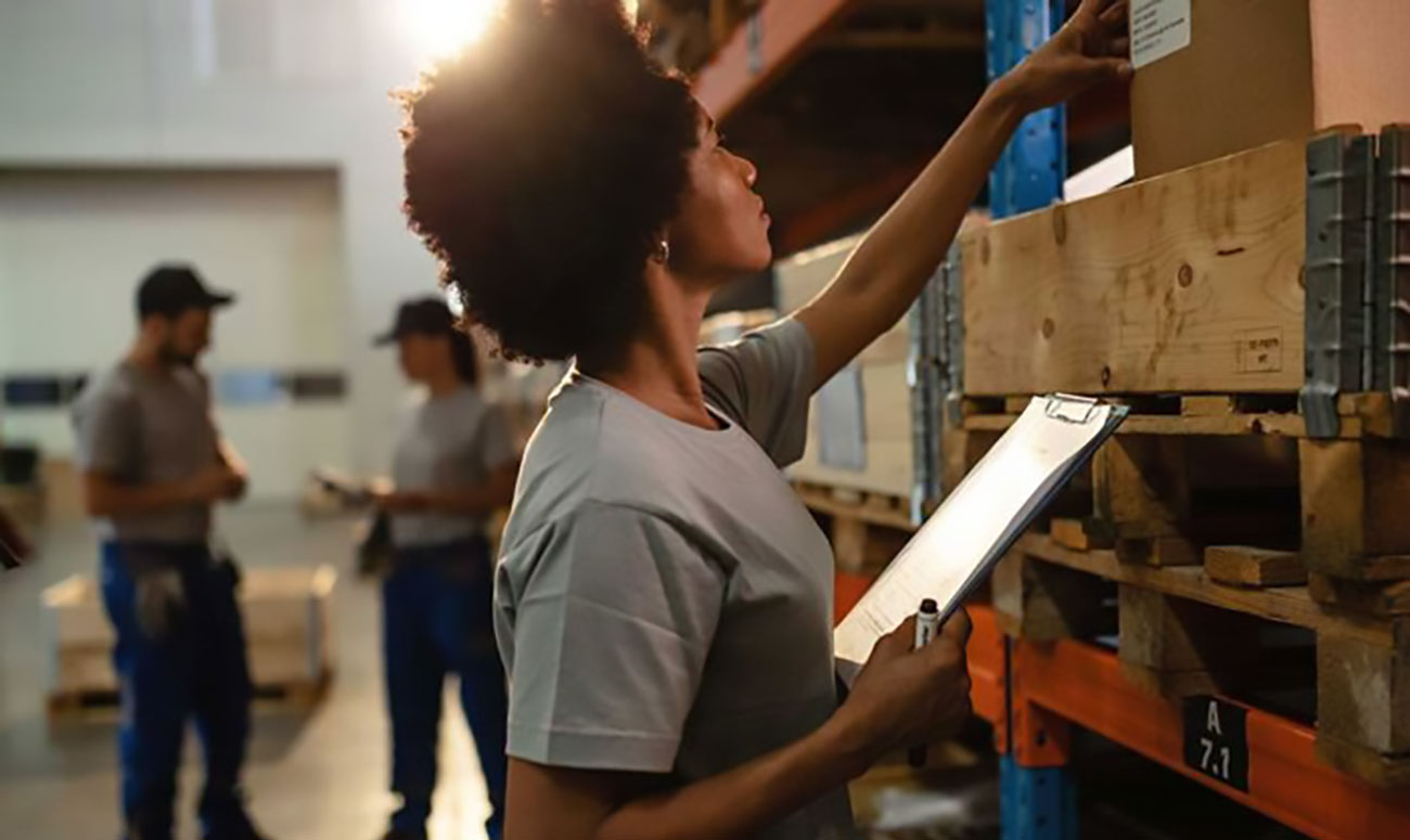 Female worker checking packages