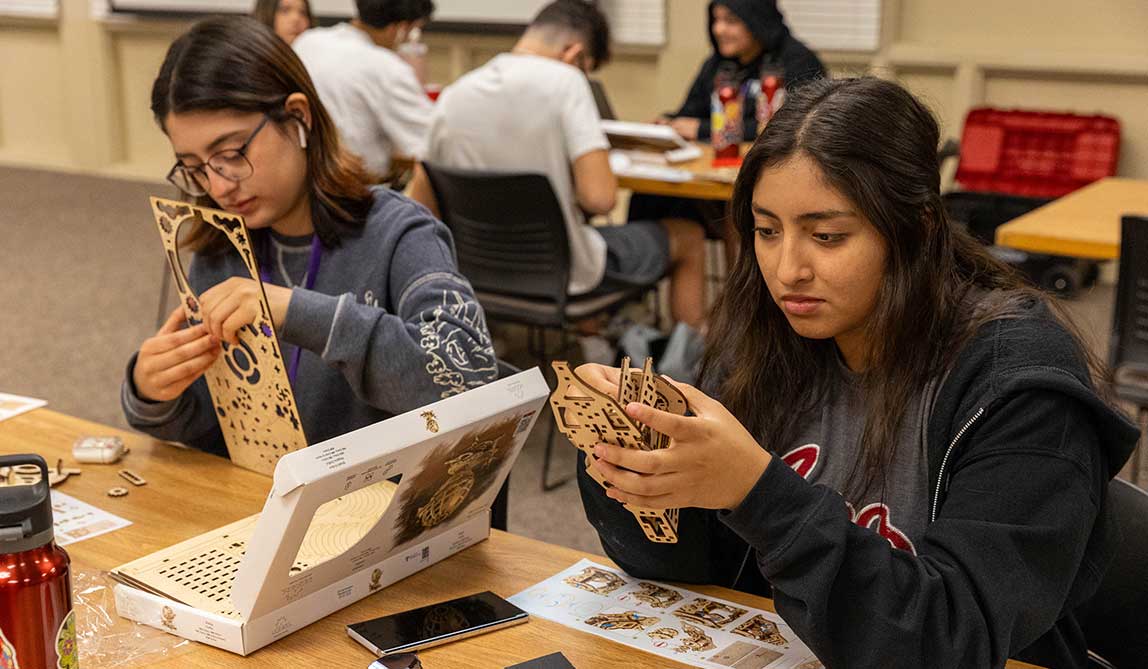 Students in the Upward Bound program work on building a project during the summer experience