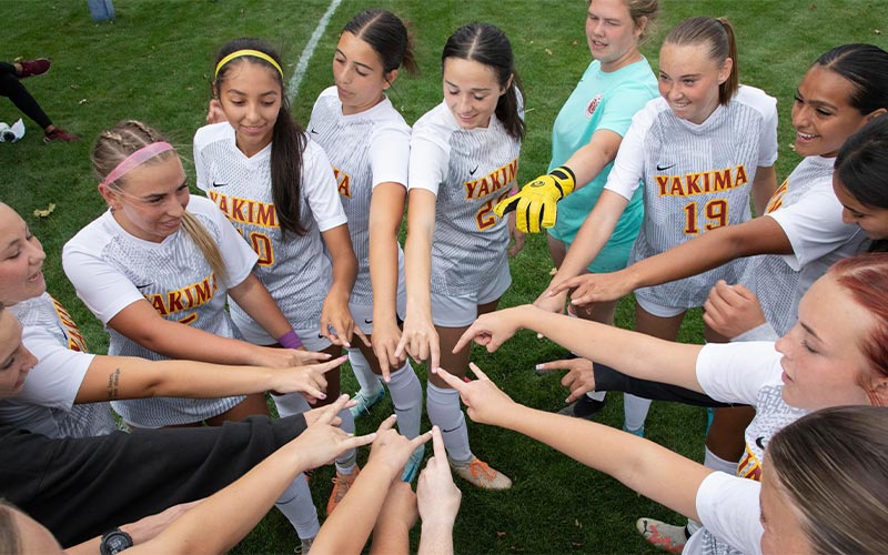 Yakima Valley College soccer players huddle before a game