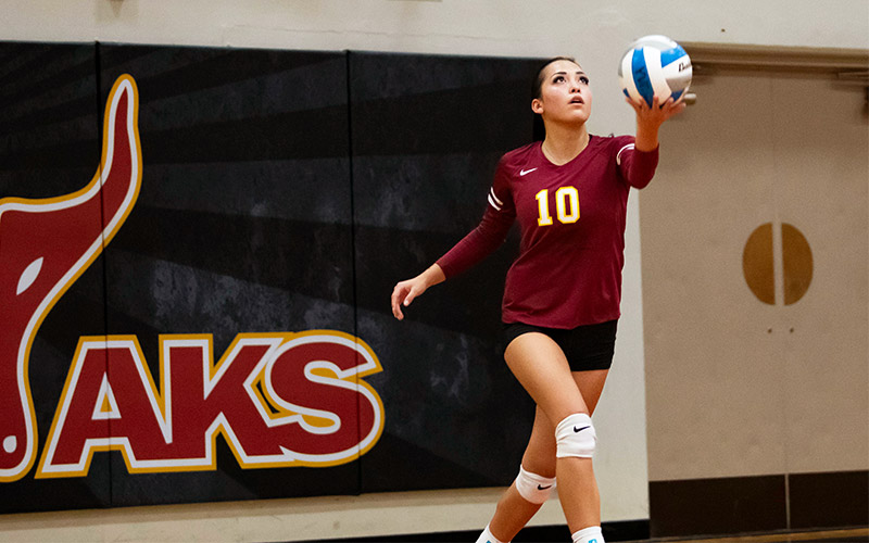 Yakima Valley College volleyball player prepares to serve