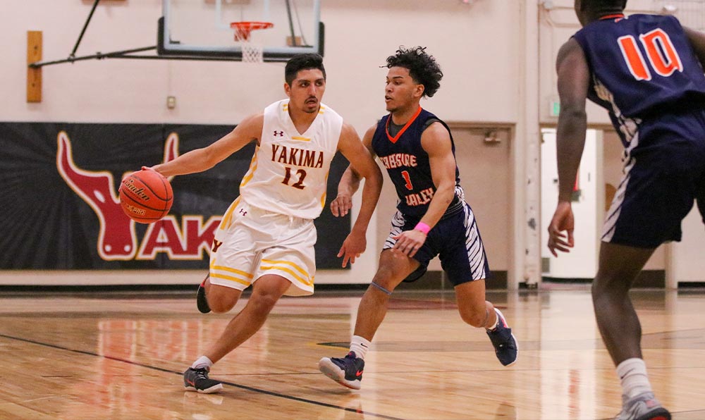 Male basketball player dribbling