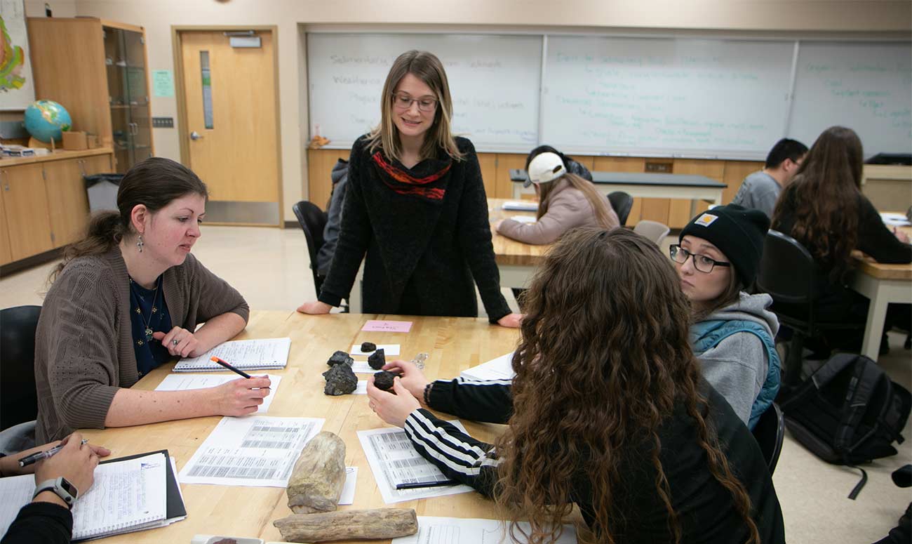 Instructor and students in geology class