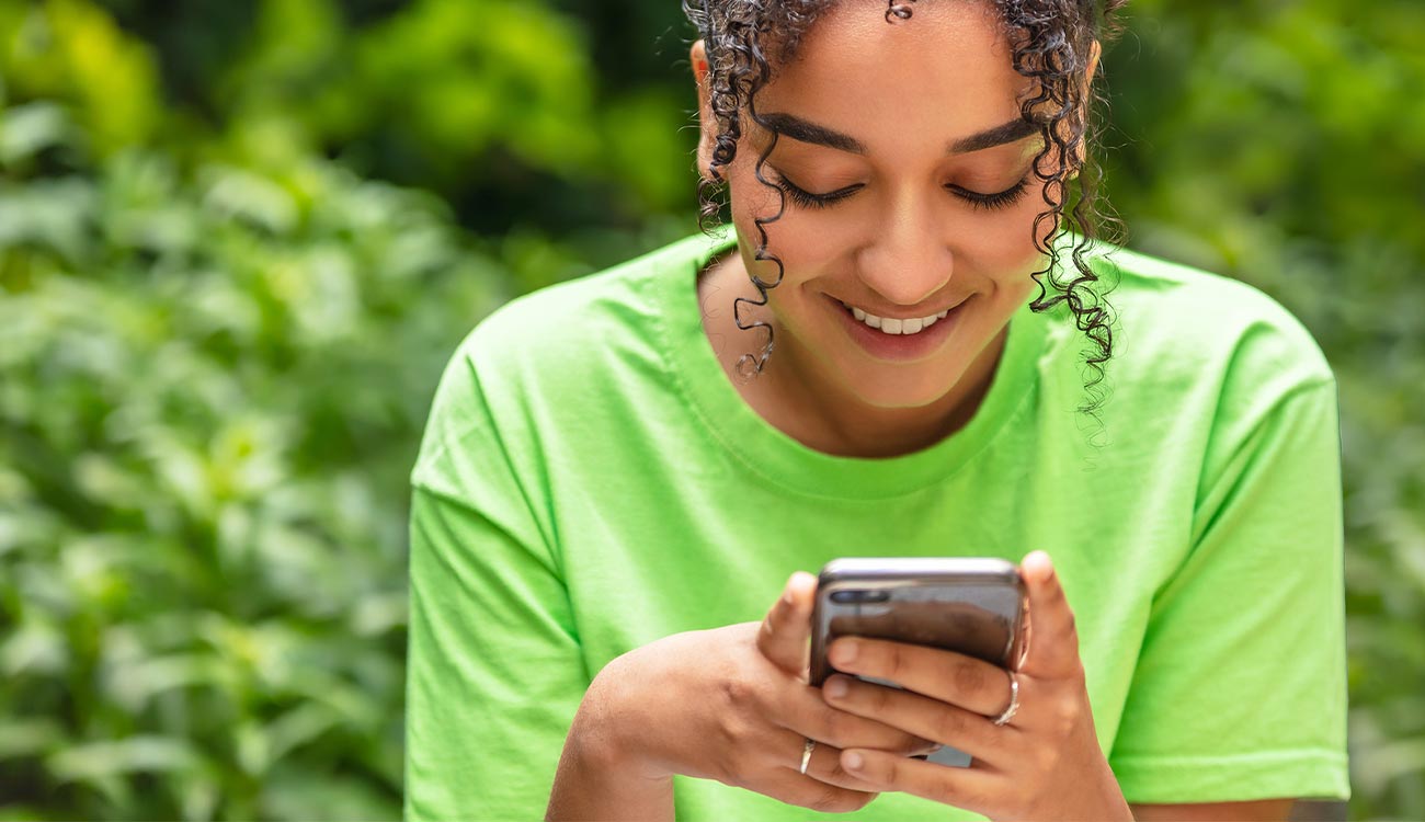 Young woman holding phone