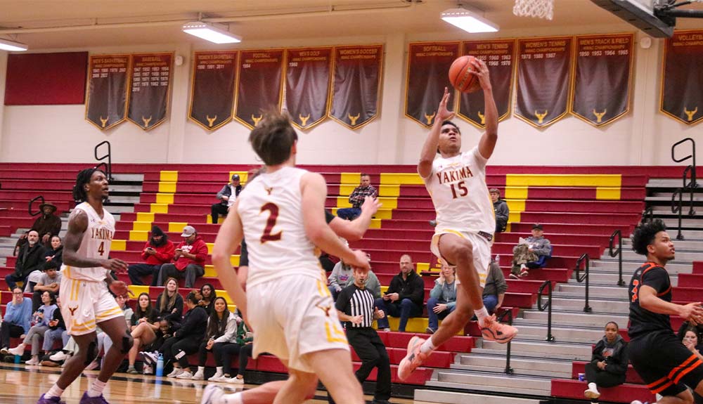 Men's basketball player attempts layup