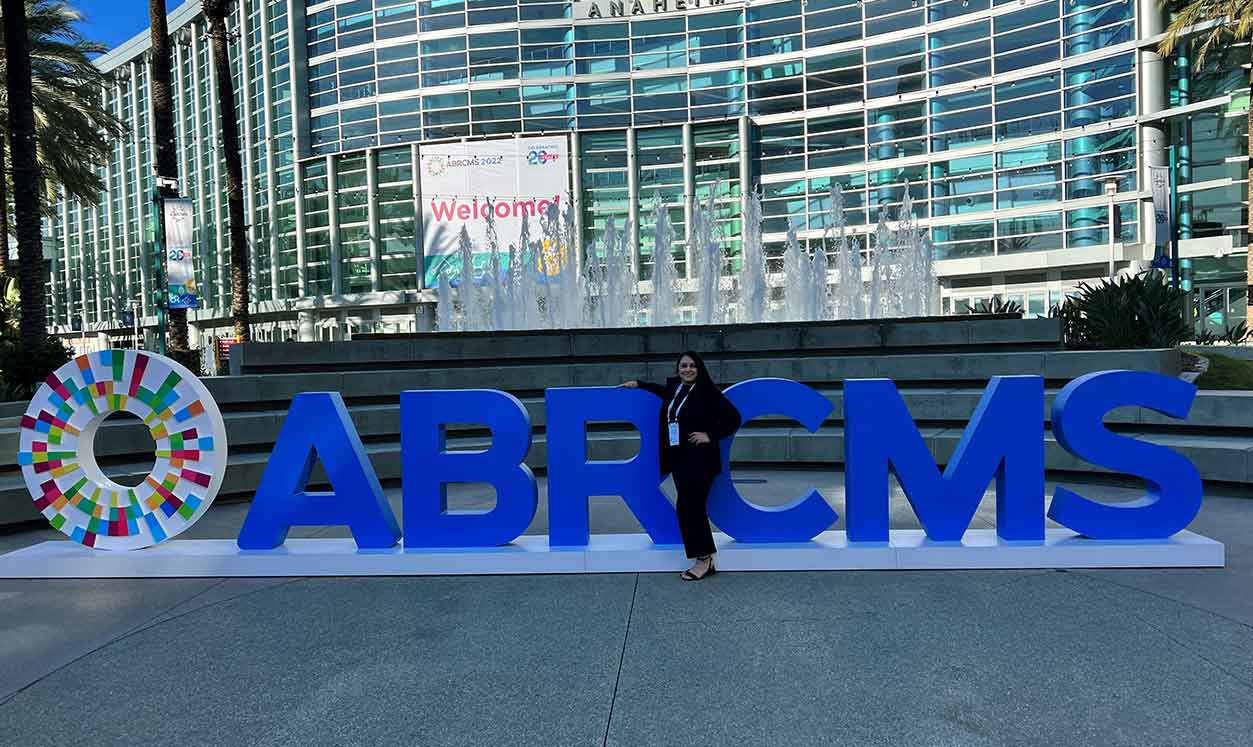 Anselma Bautista posing with ABRCMS sign