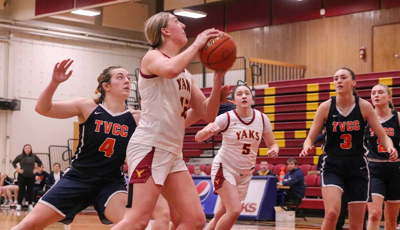 Female basketball player prepares to take shot