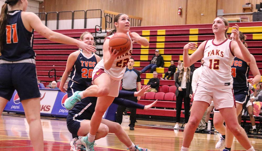 Female basketball player prepares to take a shot