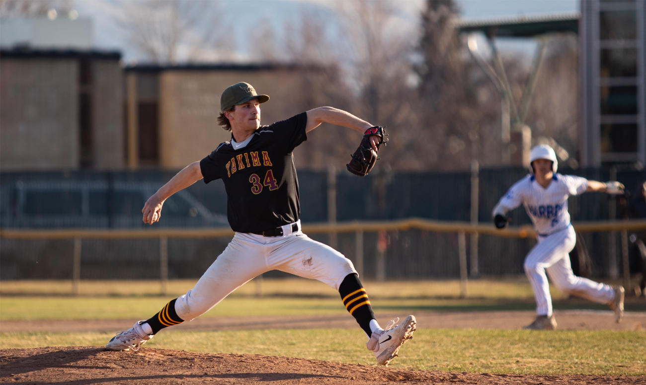 Baseball pitcher throwing pitch