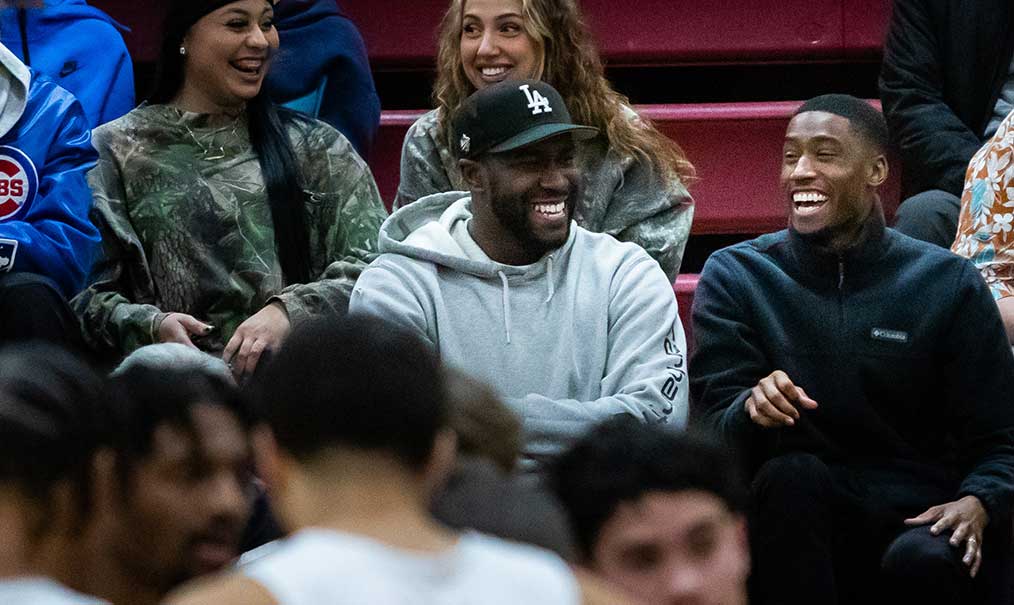 Trammell and friends cheer for the Men's Basketball Team during a recent game.