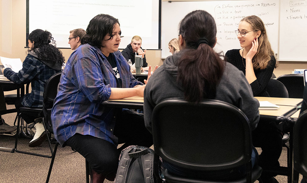 Hernandez talks with students during class. 