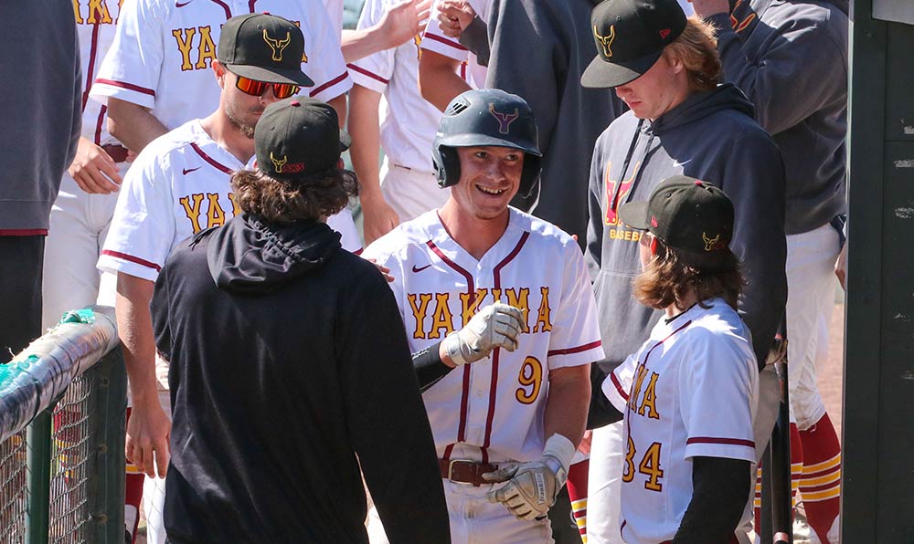 Teammates congratulate baseball player