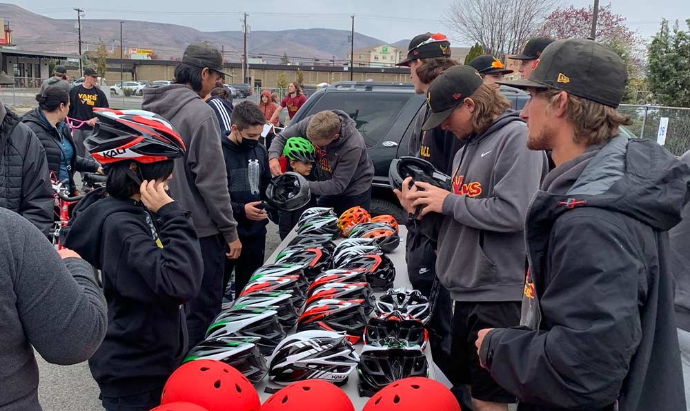 Kids getting fitted for bike helmets