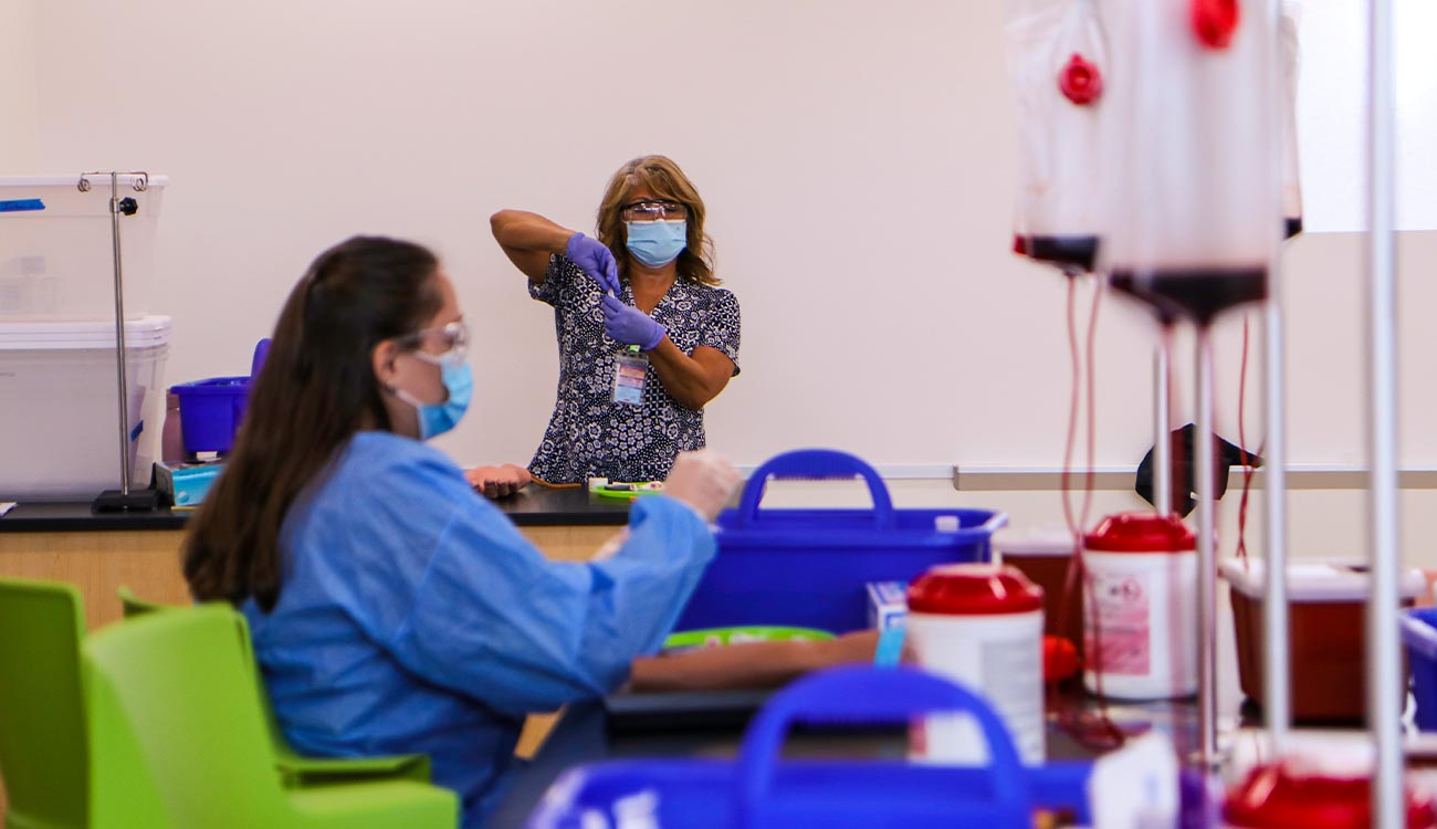 Phlebotomy instructor and student