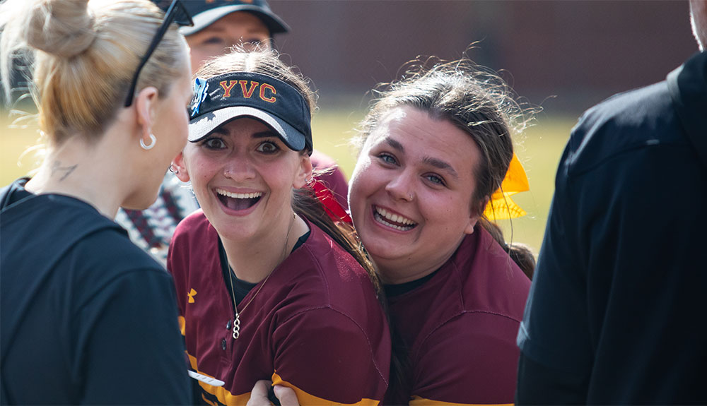 Softball players celebrate