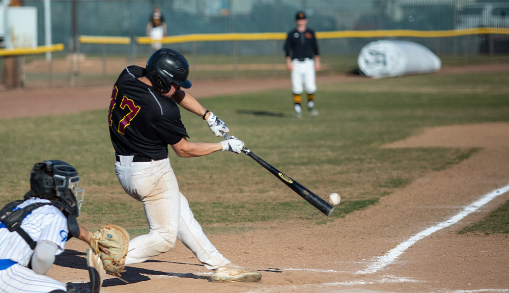 Baseball batter makes contact with ball