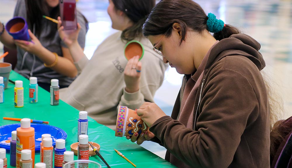 Student decorates pot