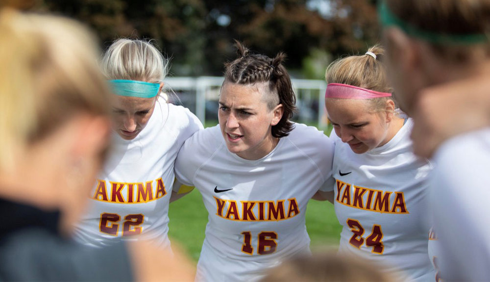 Soccer players in huddle