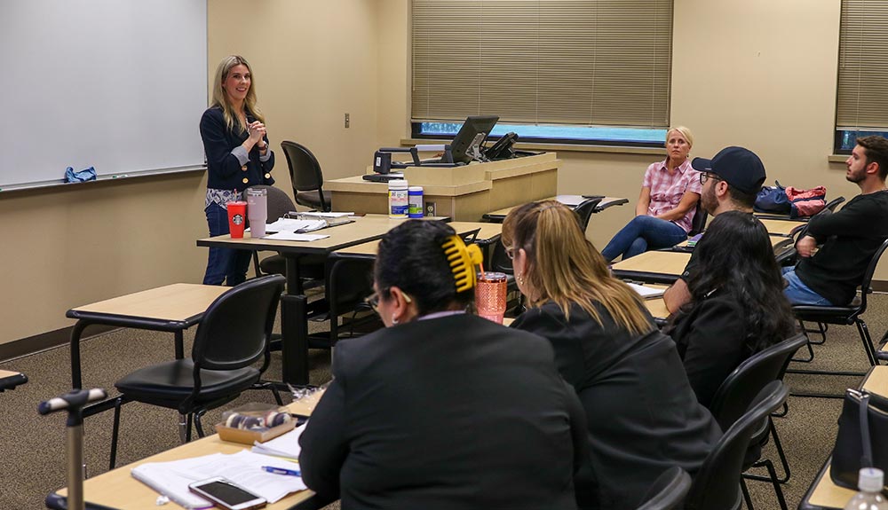 Instructor talks to class