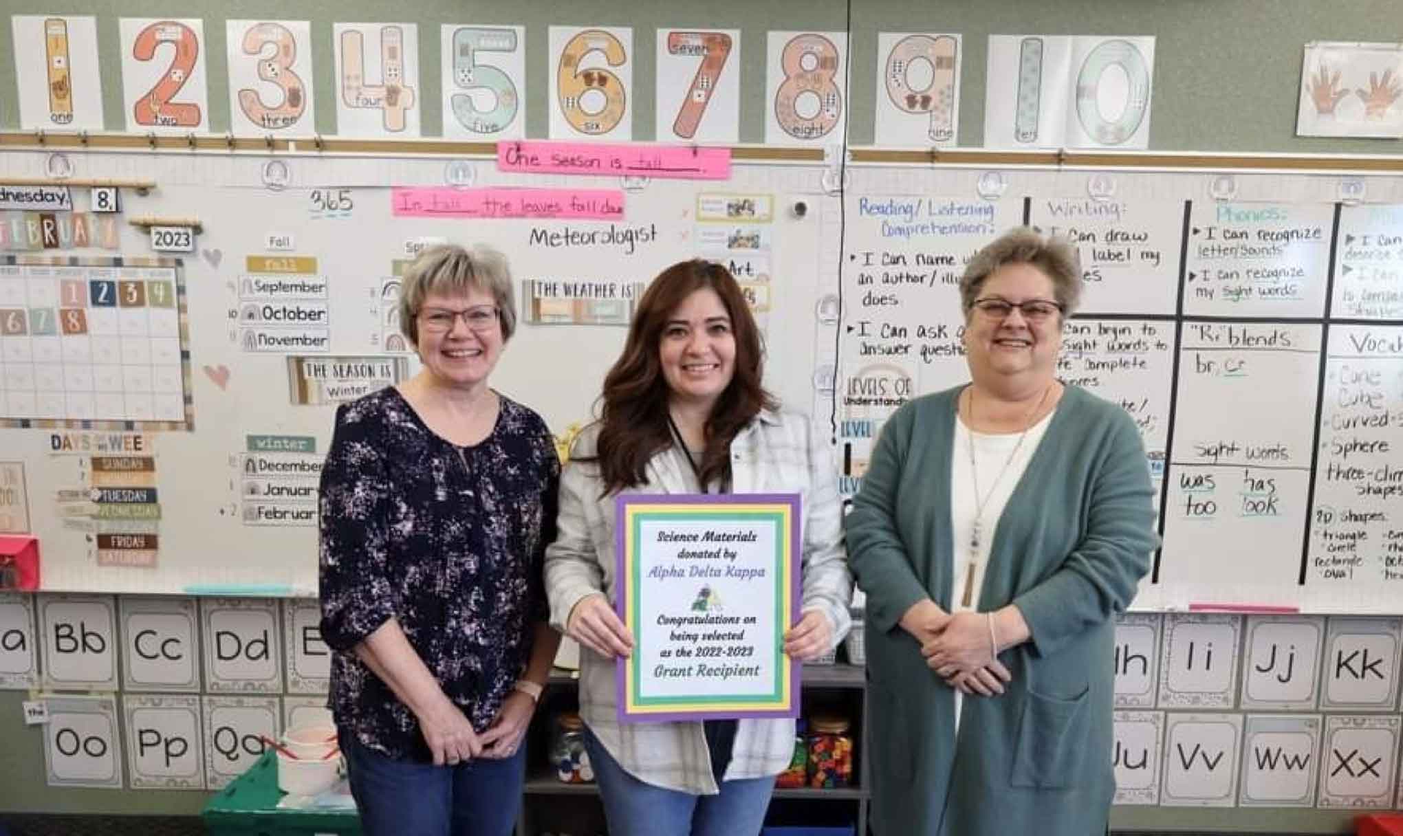 Alicia Caballero receives her award from Alpha Delta Kappa