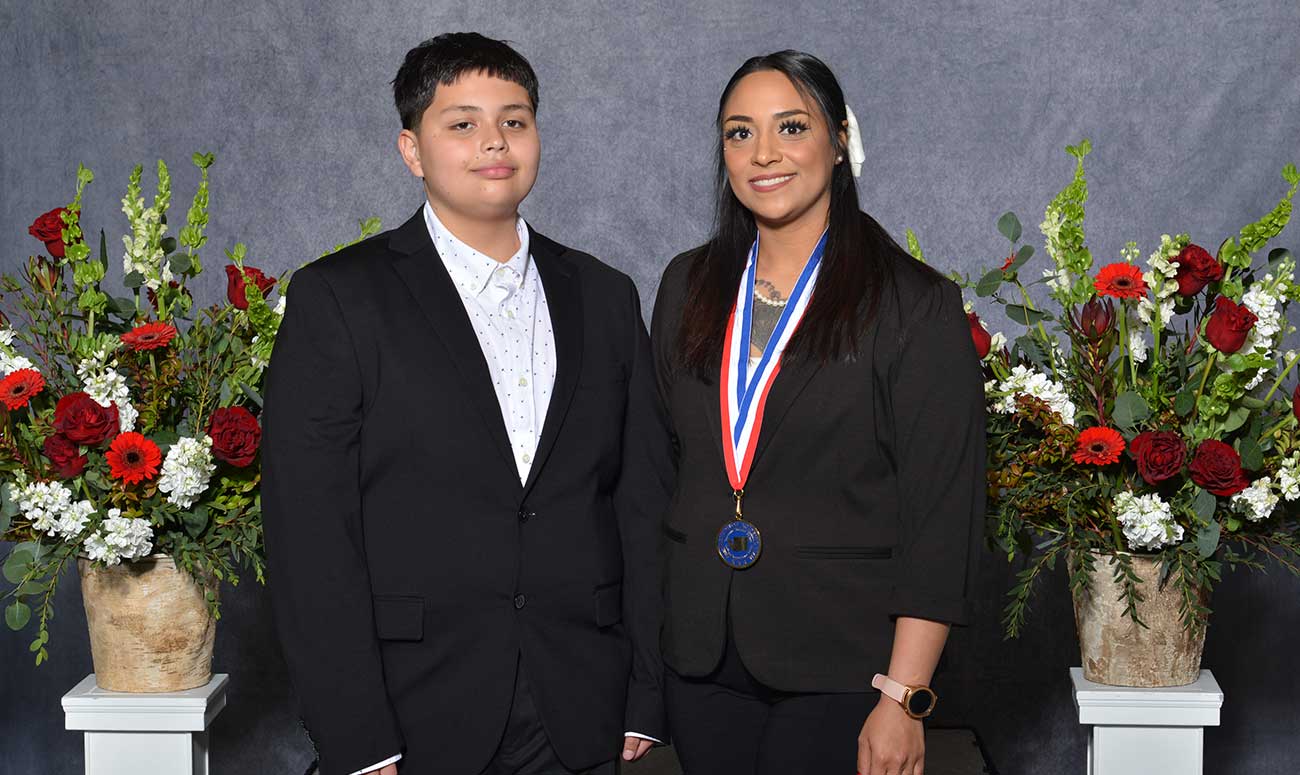 Nancy Arzaga and her son at the All-Washington Academic Team ceremony.