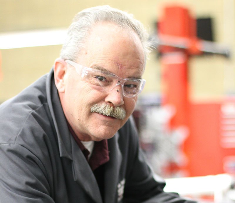 Bob Olson pictured in the autoshop.