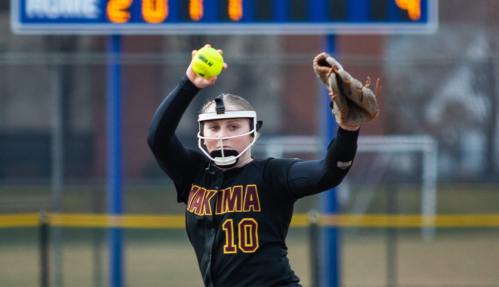 YVC softball pitcher winds up for pitch.