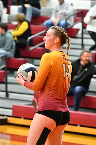 Volleyball player Mckenna Steiner prepares to serve