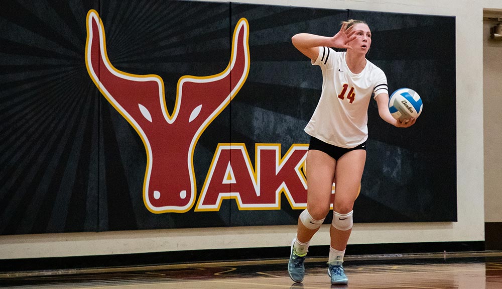 Volleyball player Mckenna Steiner prepares to serve