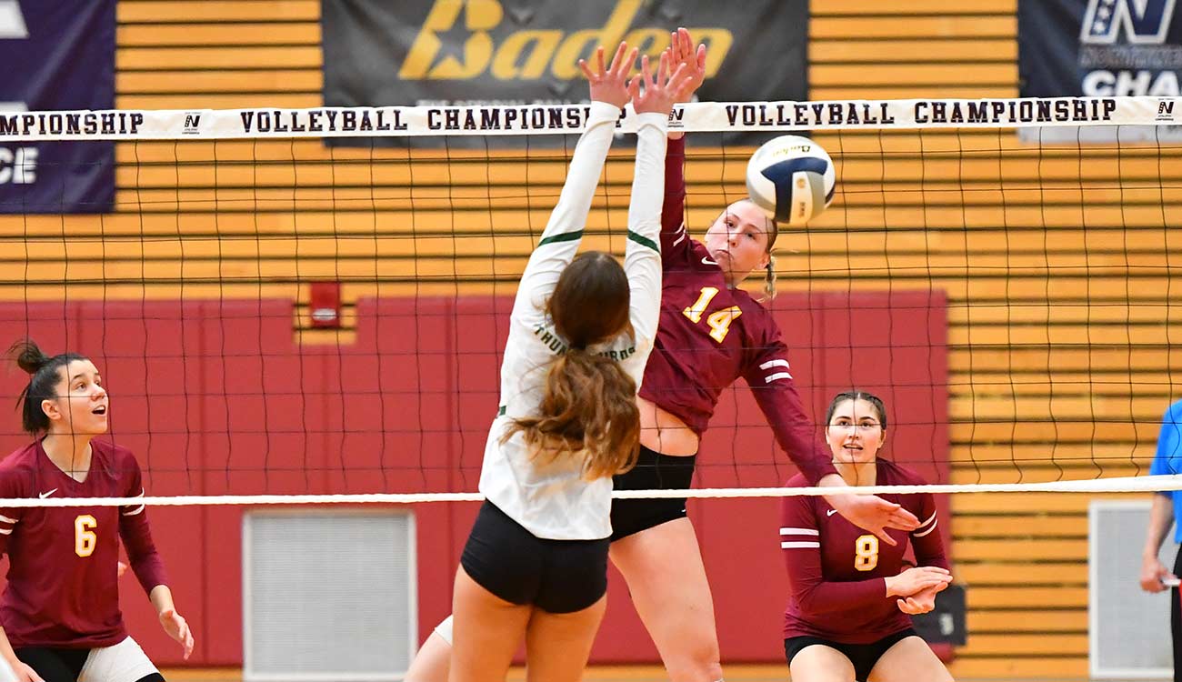 Volleyball player Mckenna Steiner spikes ball