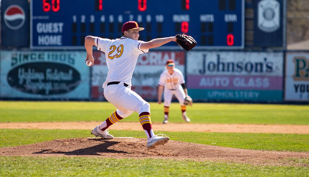 Yakima Valley College baseball pitcher winds up for throw