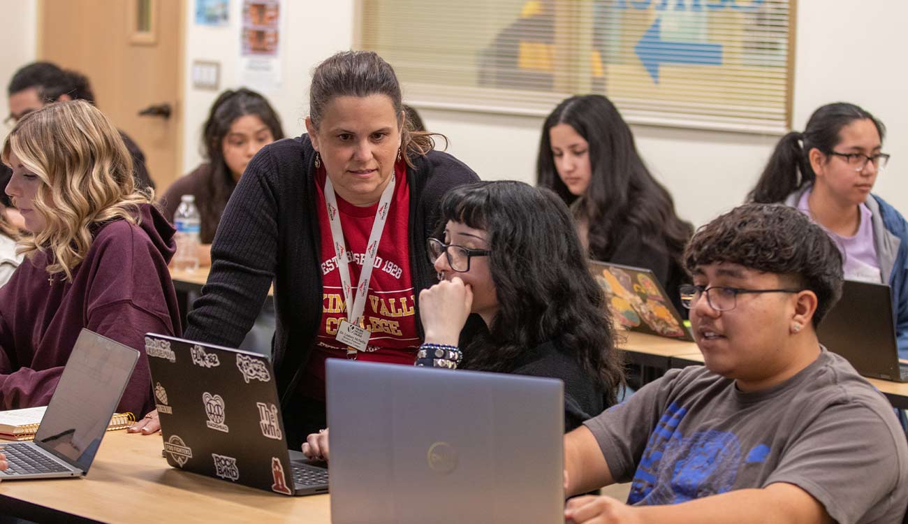 YVC History Instructor Lindsey McNellis talks to a student during class.