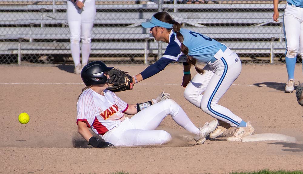 Yakima Valley College softball player slides to second base