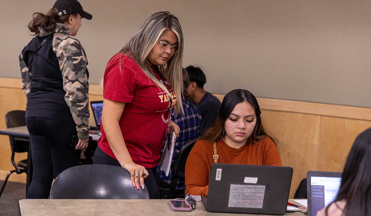 Students get help from staff during an Express Admit event