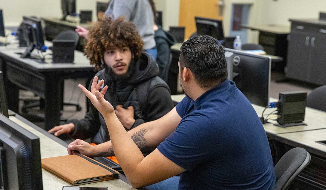 A student gets help during a financial aid workshop