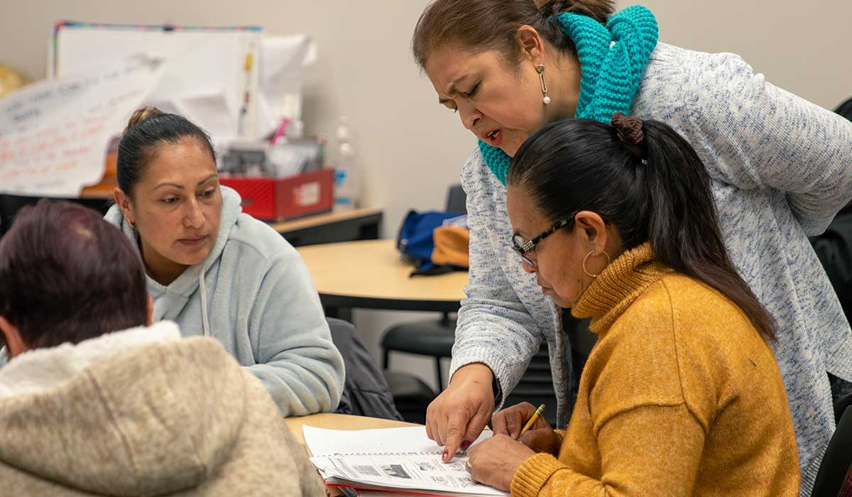 An ELA instructor works with students in class