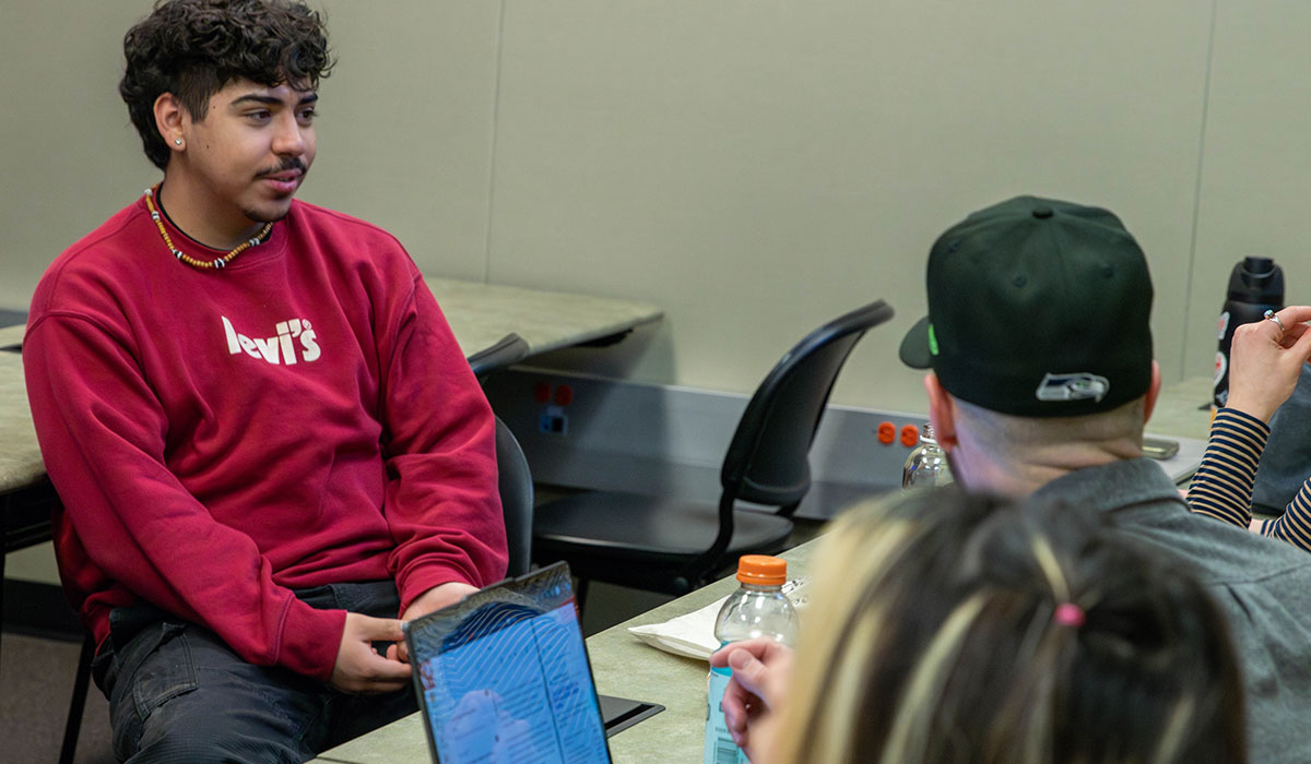 Students work on a group project in their class for the BASM program